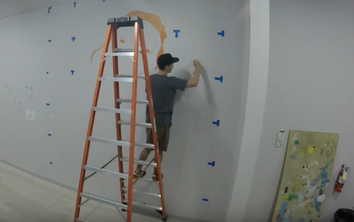 Watch This Local Artist Bring a Woman to Life at Crux Climbing Center