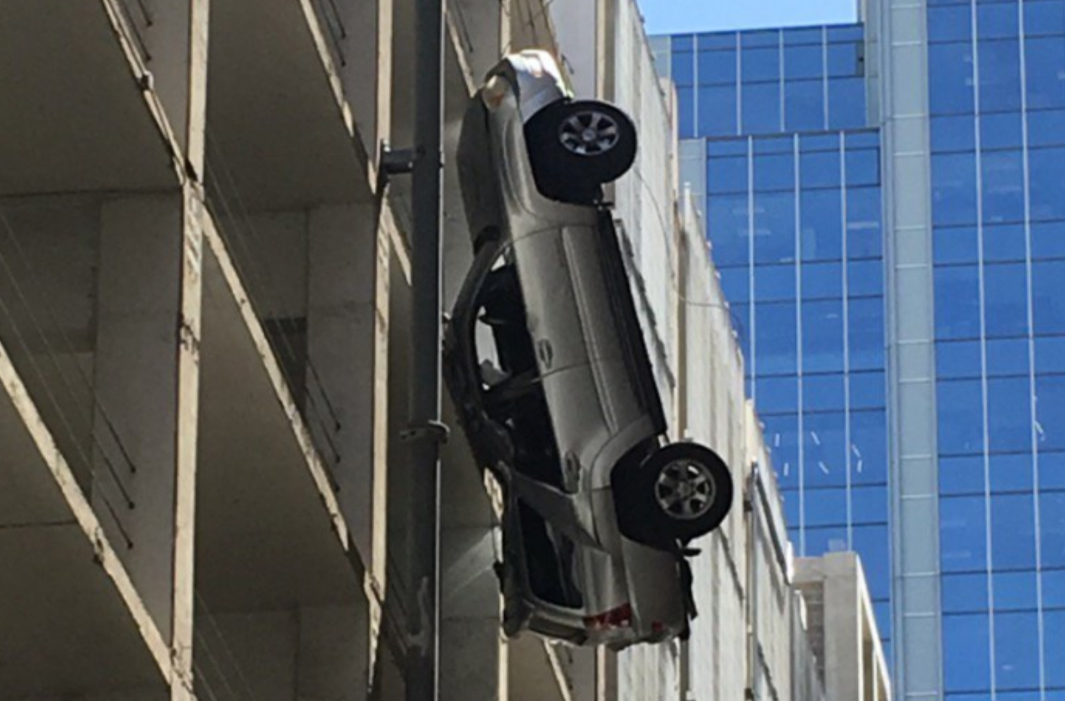 Austin.com So, There Was A Hanging Car Sticking Out Of A Building In