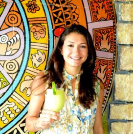 woman holding an avocado margarita at Curra's Grill in Austin