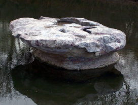 a rock sits in a stream